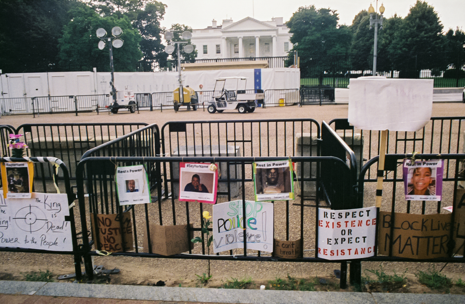 Signs dedicated to victims of police violence on fence surrounding the White House